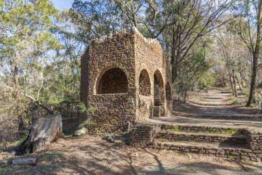 An old stone building alongside a dirt track at Evans Lookout in The Blue Mountains in Australia