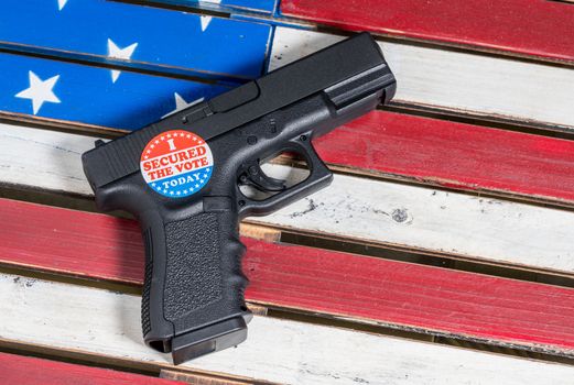 Concept of violence at voting precincts in US presidential election with gun and I Secured the Vote campaign button