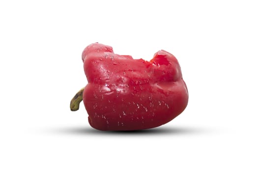 Bite red bell pepper  isolated on white background