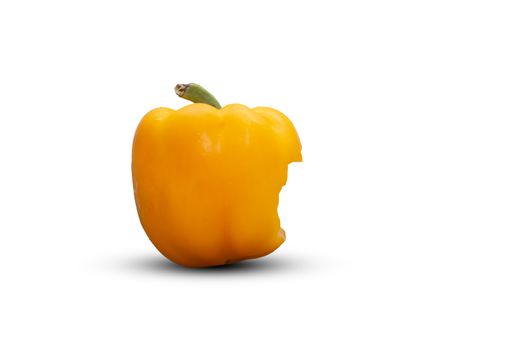 Bite yellow bell pepper  isolated on white background