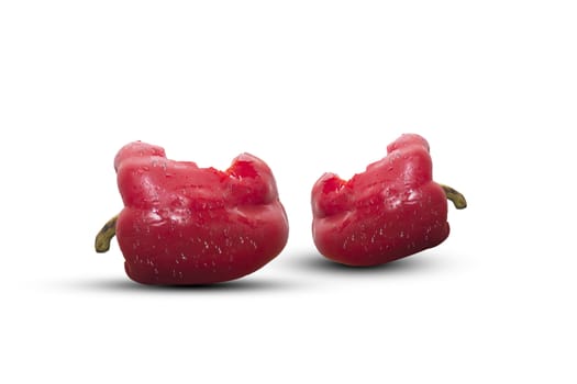 Bite two red bell pepper  isolated on white background