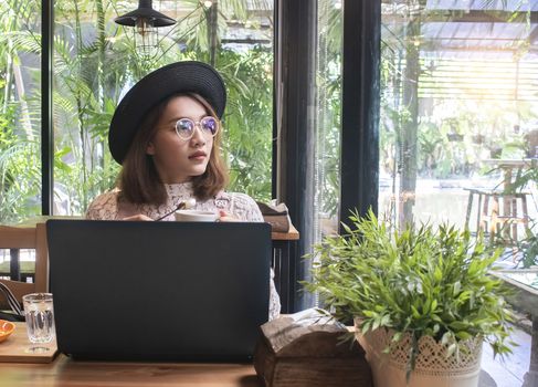 Asian woman in coffee shop cafe