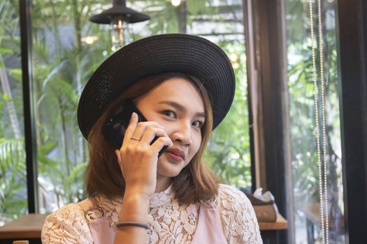 Happy asian women with smartphone