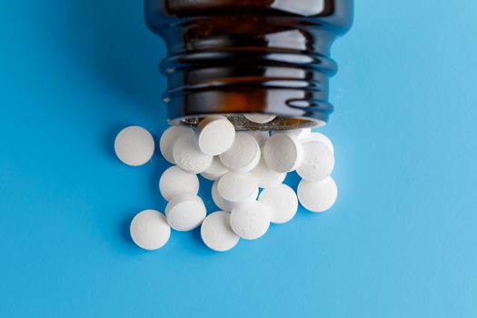zinc tables, nutrition supplement pills on blue background