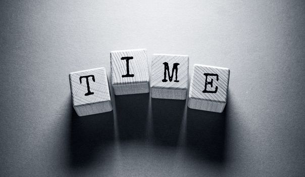 Time Word Written on Wooden Cubes