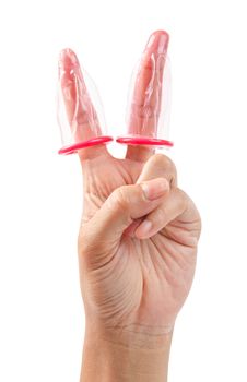 Hand shows victory sign with a pink condom isolated on white background, Save clipping path.