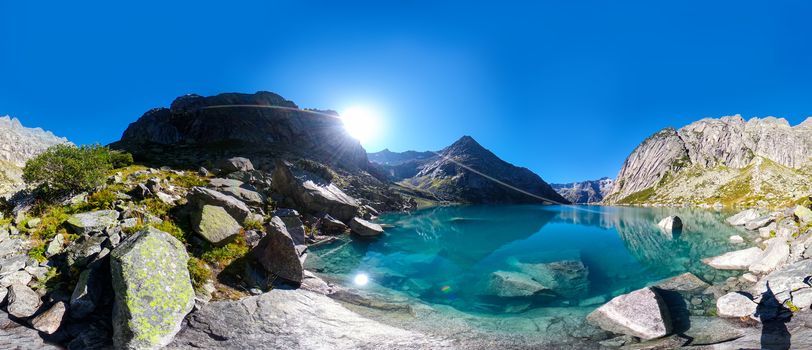 Gelmersee. Dam in the Swiss alps for Hydro power. Clear Blue lake with clear sky.