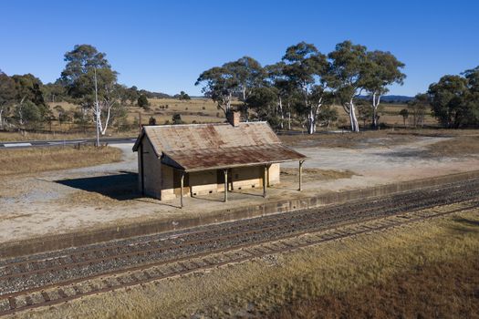 Old train station near a railway track in rural New South Wales, Australia.