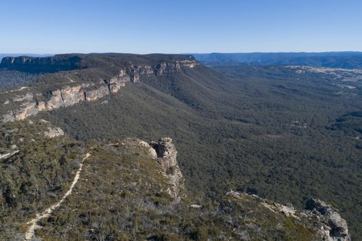 Mountain range and valley on a clear cloudless day in The Blue Mountains in New South Wales, Australia.