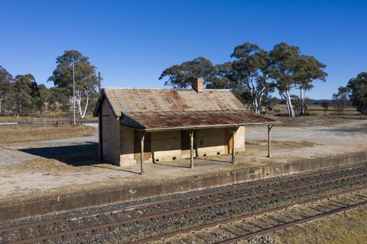 Old train station near a railway track in rural New South Wales, Australia.