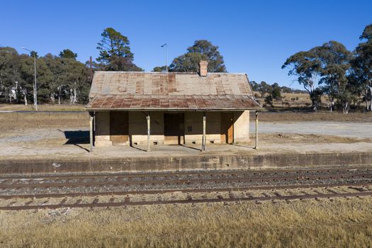 Old train station near a railway track in rural New South Wales, Australia.