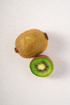 Kiwi fruits half sliced on white background, macro