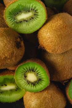 Kiwi fruit half sliced close up macro, healthy lifestyle and food, vibrant green color