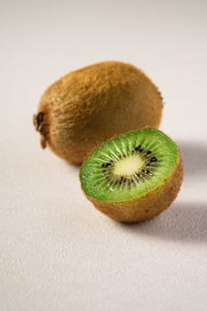 Kiwi fruits half sliced on white background, macro