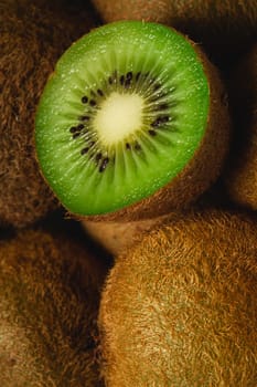 Kiwi fruit half sliced close up macro, healthy lifestyle and food, vibrant green color