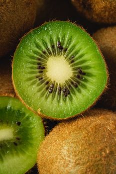 Kiwi fruit half sliced close up macro, healthy lifestyle and food, vibrant green color