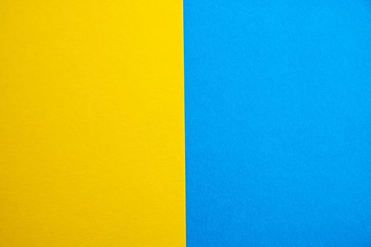 blue-yellow matte suede background, close-up. Velvety texture