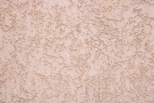 Pink decorative relief . Pink stucco wall. Pink background of the wall