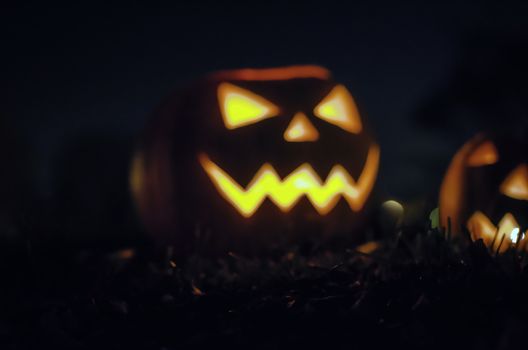 Halloween pumpkin on dark background. Scary Halloween pumpkin at dark background