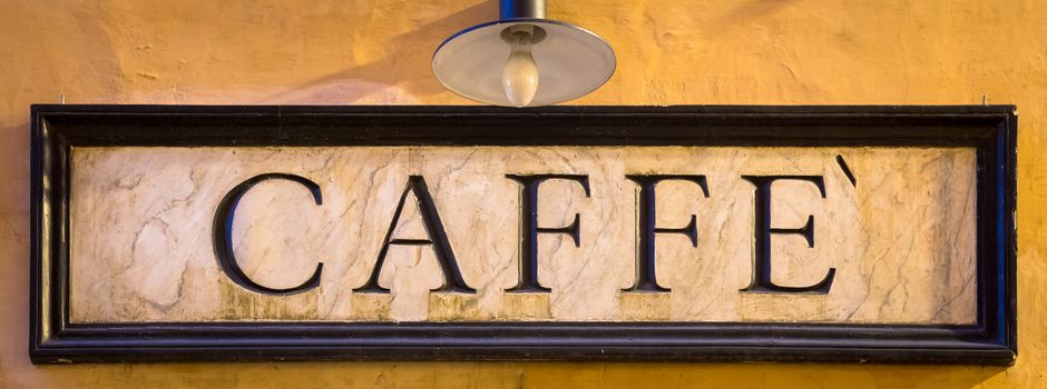 Rome, Italy. Tradiotional vintage style coffee sign on the wall.