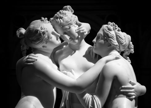 Milan, Italy - June 2020: Antonio Canova’s statue The Three Graces (Le tre Grazie). Neoclassical sculpture, in marble, of the mythological three charites (made in Rome, 1814-1817)