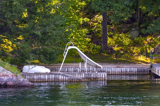 A children's slide is installed at the boat dock so that children can descend directly into the river