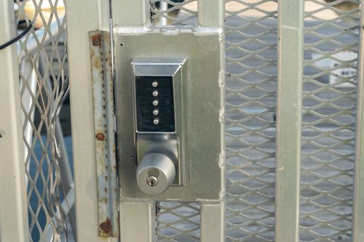 A lock with an additional secret code of five combinations is welded to the metal door