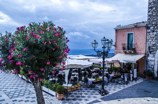 View of the mediterranean sea from a square in the city of taormina sicily italy