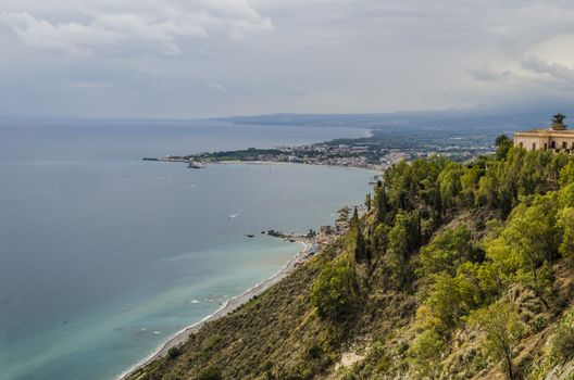 Mediterranean sea and beaches of sicily near the city of taormina