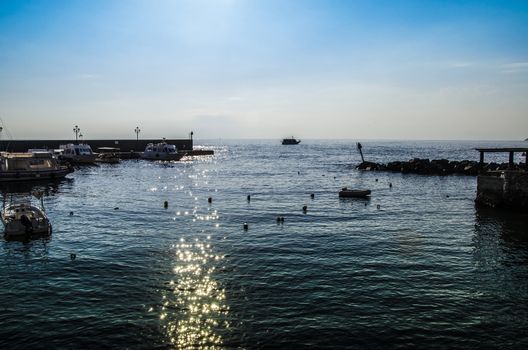 Port moorings and boats on a sunrise on the aeoliand  island of  lipari italy 
