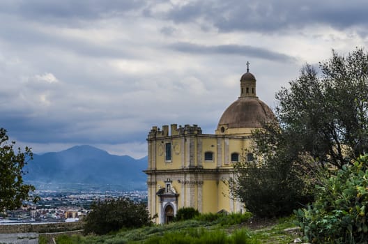 Baroque church the city of milazzo in the environs of its port and the landscape of the Sicilian territory with its mountains