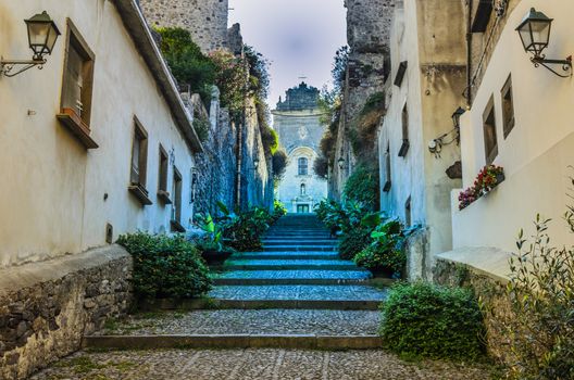 Stairways in a street on the way up and on top the main church of the island of lipari italy