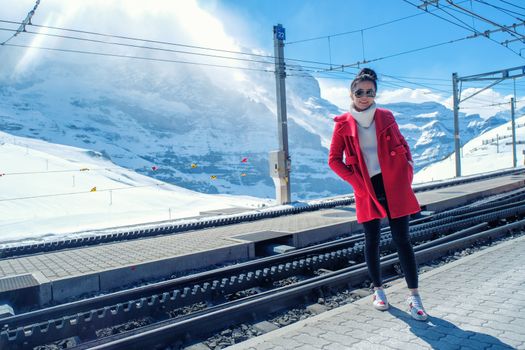 Asian woman in train station, Switzerland