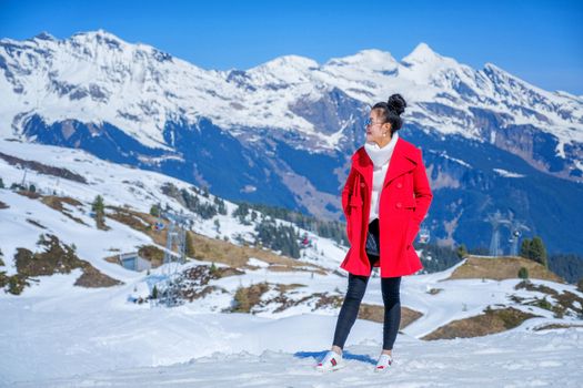 Young Woman Tourists see beautiful viewpoitn near Kleine Scheidegg station In daylight atI Switzerland