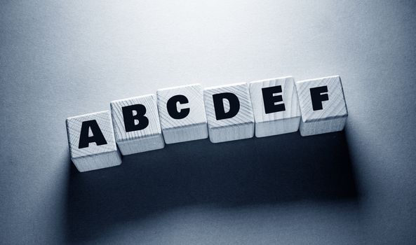 Alphabet English Word Written on Wooden Cubes