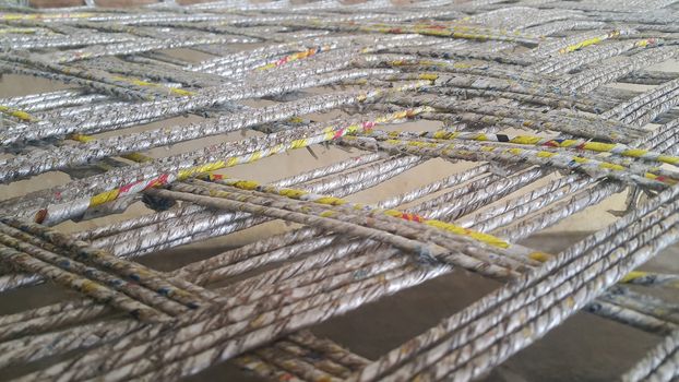 Closeup view of dried jute thread or ropes interwoven for making traditional old style bed called charpai
