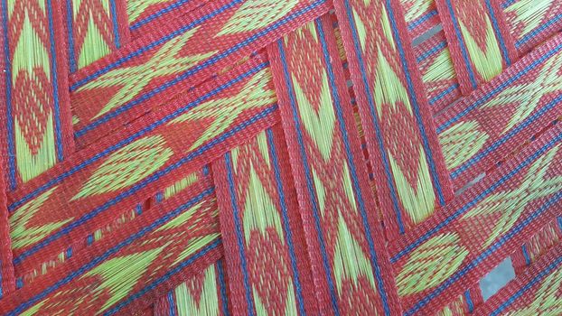 Colorful plastic woven stripes of traditional bed used in rural areas.