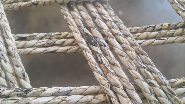 Closeup view of dried jute thread or ropes interwoven for making traditional old style bed called charpai