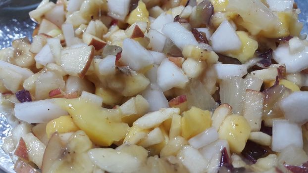 Closeup view of fresh tasty and spicy homemade fruit chaat dish. Chaat is traditional dish in South Asian countries