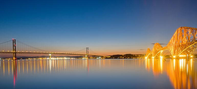 Panorama of the two bridges over the Firth of Forth in Scotland at dawn