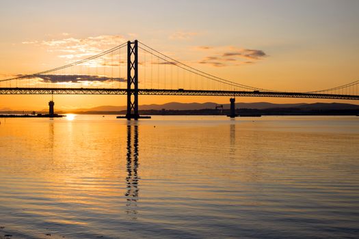 The Forth road bridge in Scotland at dawn