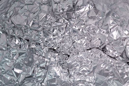 abstract wrinkled aluminum foil close-up full frame background