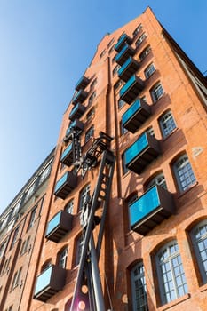 A very high brickwall building seen in Hamburg, Germany