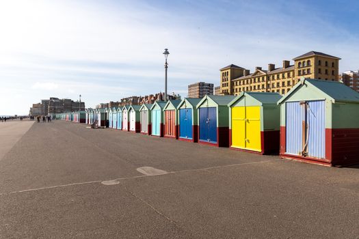 Colourful beach huts on the Seafront Esplanade, Brighton, Sussex, UK