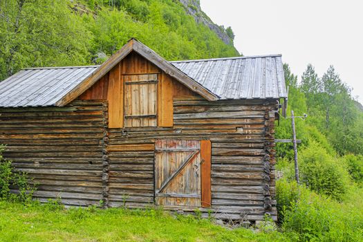 Old brown wooden cabin hut in Hemsedal, Norway.