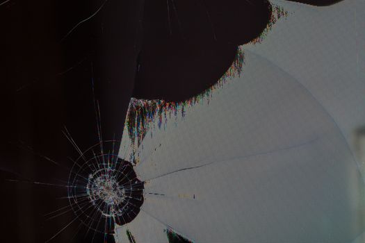 broken lcd tft tn screen flat macro texture with crystal leakage and physical damage cracks, closeup with selective focus and blur.