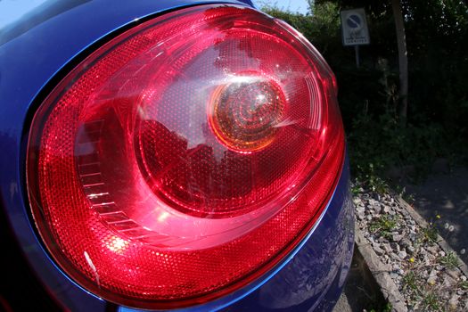 Black premium city crossover, luxury SUV rear light closeup.