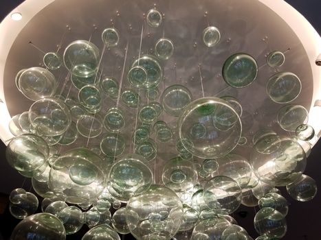 large fragile glass chandelier and light with spherical shapes