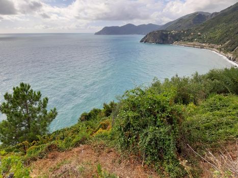 Cinque Terre, Italy - 09/02/2020: Beautiful landscape of a coastal fishing village, amazing view on many little colorful houses, traditional architecture of the little Italian town called Cinque Terre