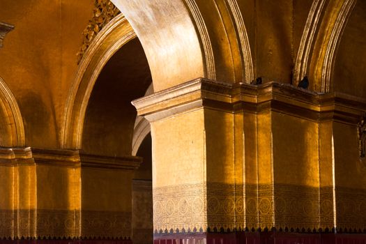 The Mahamuni Buddha Temple, Mandalay, Myanmar(Burma)12/12/2015 interiors. The Mahamuni Buddha Temple, a Buddhist temple and major pilgrimage site, red and golden wall High quality photo